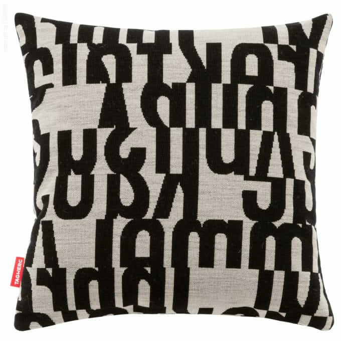 The cushion by TAGWERC with the letters pattern in black and taupe by designer Gunnar Aagaard Andersen.